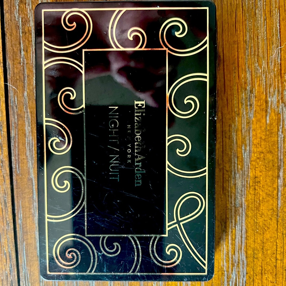 Elizabeth Arden Black and Gold Swirl Design